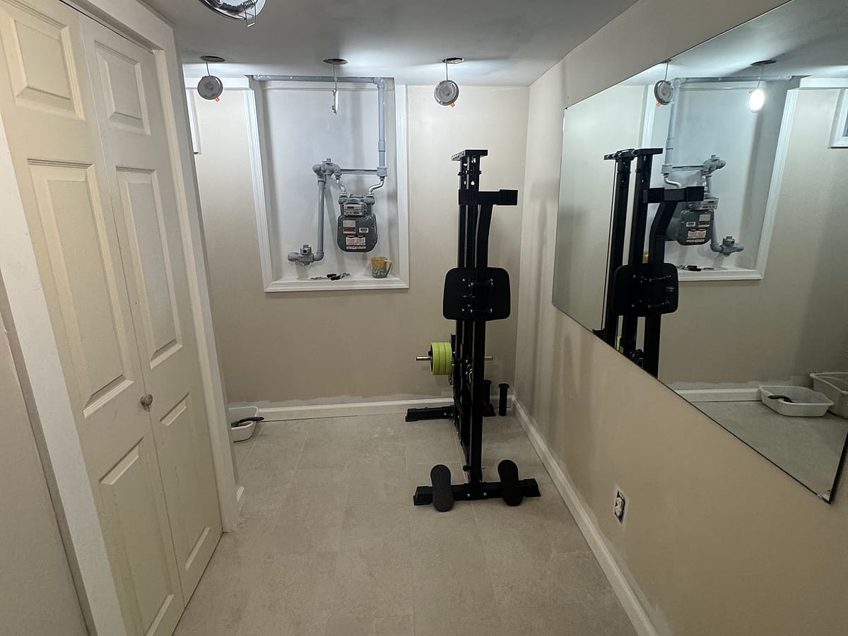 Finished basement room with drywall, paint and new flooring
