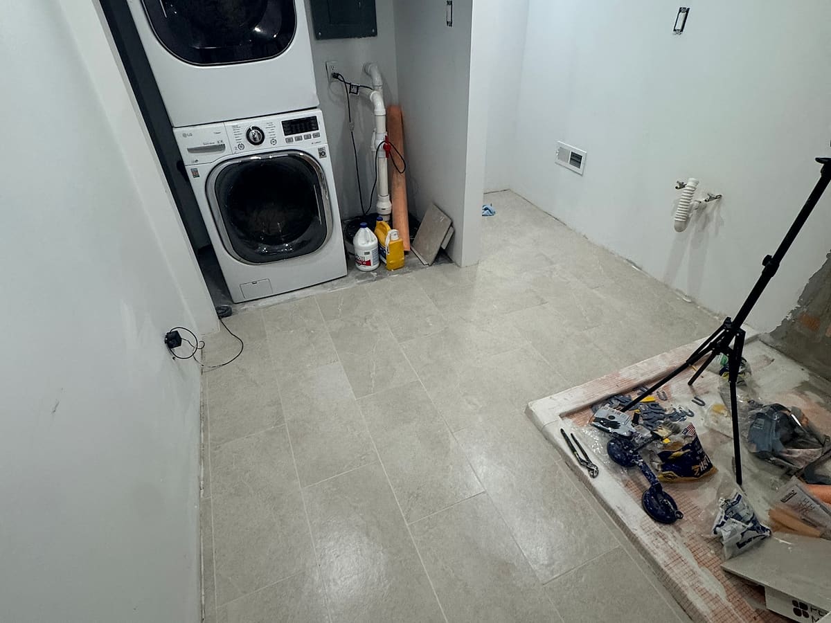 Finished basement laundry with painted walls and new floor