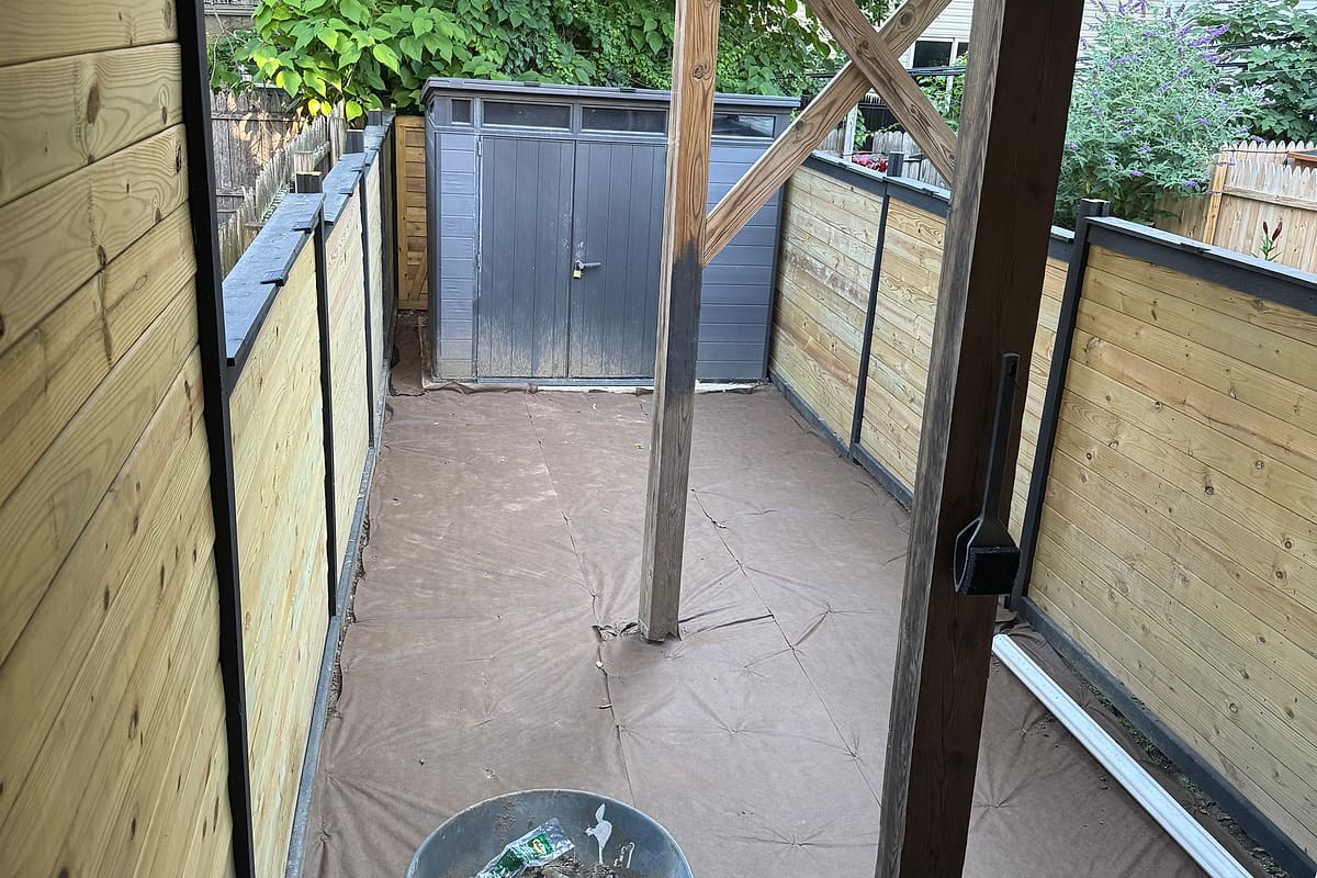 New horizontal wood privacy fence along a backyard
